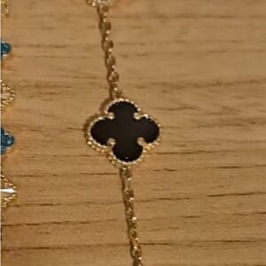 Elegant Gold and Black Clover Necklace